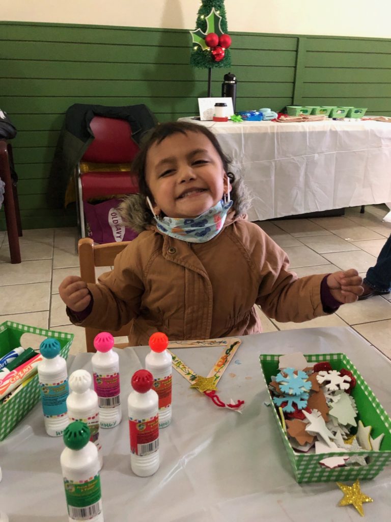 Young child playing with crafts